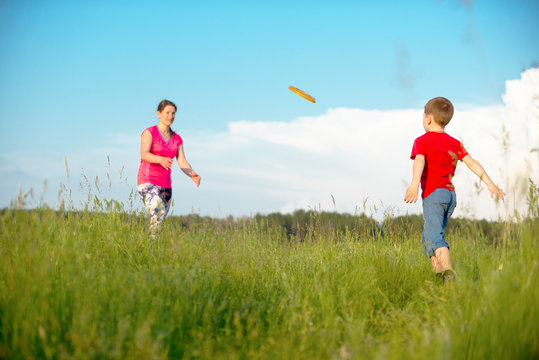Mom and son play frisbee, Chernigov, Ukraine, May 30, 2019.