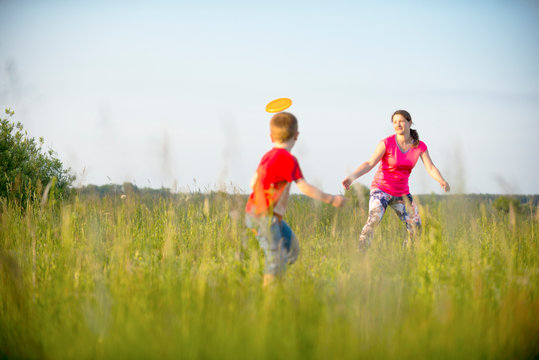 Mom and son play frisbee, Chernigov, Ukraine, May 30, 2019.