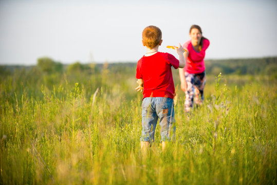 Mom and son play frisbee, Chernigov, Ukraine, May 30, 2019.