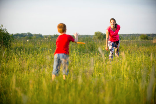 Mom and son play frisbee, Chernigov, Ukraine, May 30, 2019.