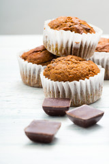 chocolate cupcakes, old white wooden table