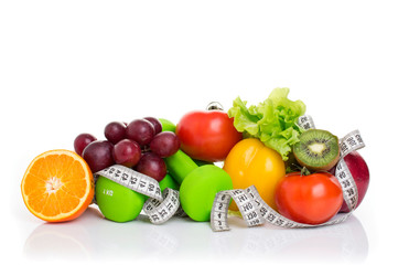 fitness equipment and healthy food isolated on white. apple, pepper, grapes, kiwi, orange, dumbbells and measuring tape.