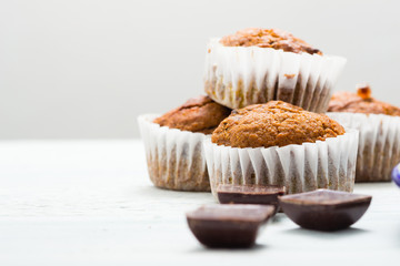 chocolate cupcakes, old white wooden table