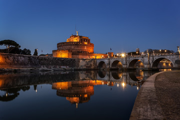 Evening landscape on the Bridge of the Holy Angel in Rome.