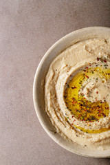 Hummus with olive oil in ceramic