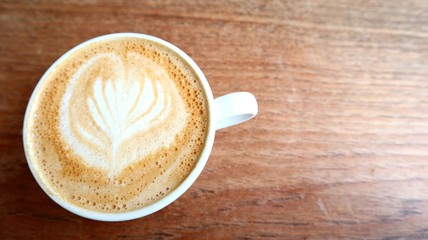 Cappuccino on a wooden table