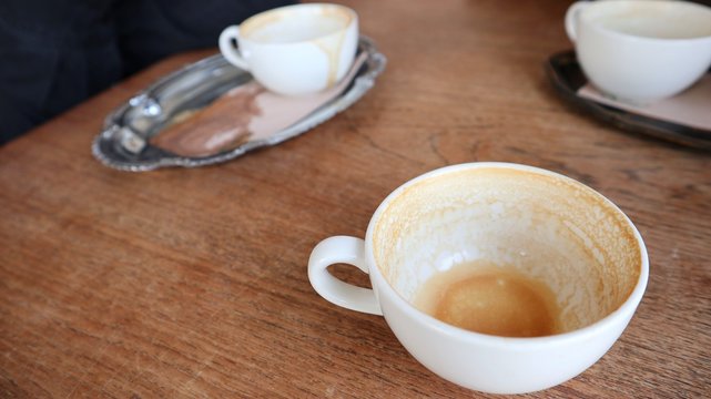 Empty cups on a wooden table
