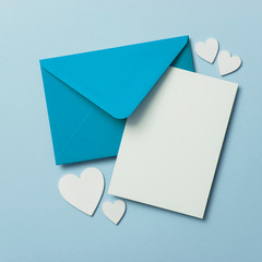 Father's Day card mockup. Blue envelope blank white card and hearts