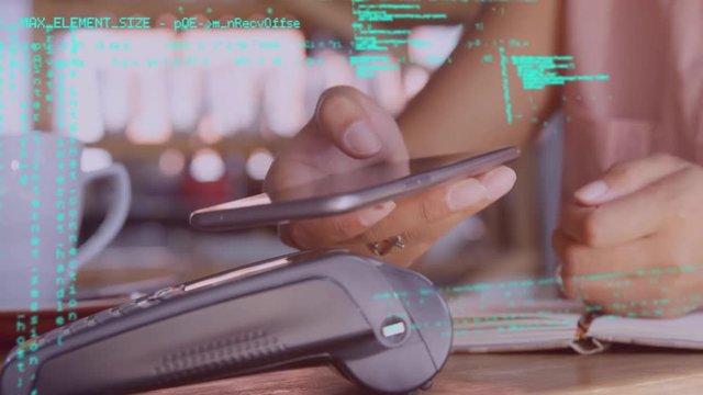 Woman paying using mobile device