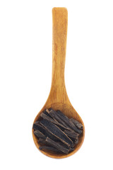 heap of vanilla seeds in wooden spoon isolated on white background