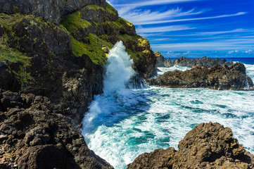 Fototapeta na wymiar Seixal ocean natural pools and bay at Madeira northern coastline stormy day