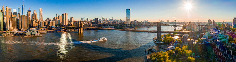 New York, New York, USA skyline with Brooklyn and Washington bridges near the Manhattan island.