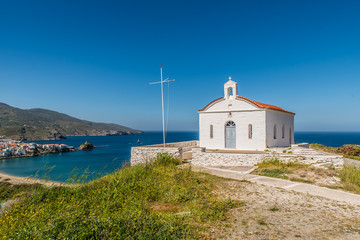 Fototapeta na wymiar An old orthodox church in a hill next to chora of Andros, Cyclades, Greece