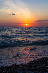 Obraz premium Amazing sea sunset, the sun, waves, clouds