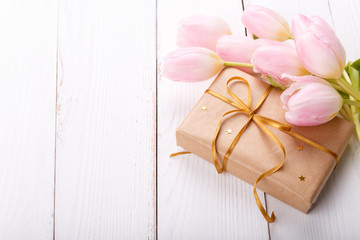 Gift box and pink tulips
