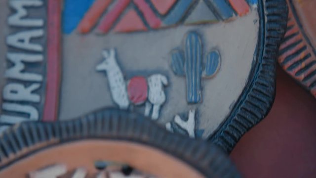 Different beautiful handmade artisan decoration plates. Close up shot.