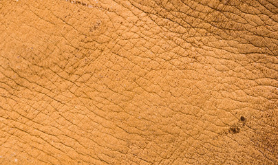 Old vintage genuine soft brown leather texture background, top layer with pores and scratches,...