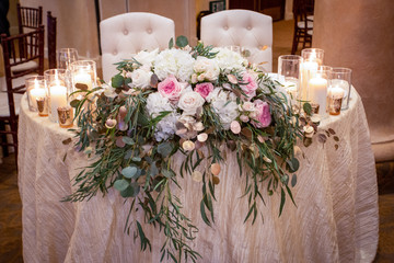 bridal bouquet of flowers on table at wedding reception