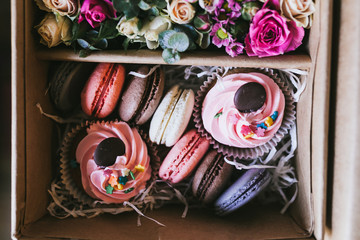 Multicolored handmade macarons in a gift box