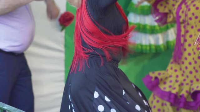 Spain - Flamenco. Women in traditional dresses dancing flamenko.