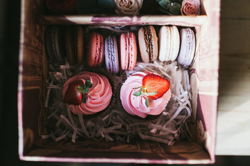 Multicolored handmade macarons in a gift box