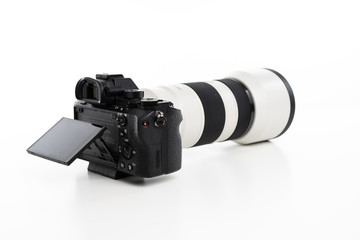 Mirrorless camera on pure white background with white lens attached
