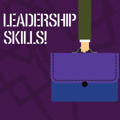Text sign showing Leadership Skills. Business photo showcasing Skills and qualities that leaders possess Taking a lead Businessman Hand Carrying Colorful Briefcase Portfolio with Stitch Applique