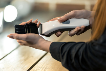 haircut and beauty, women's hands set the nozzle on the clipper