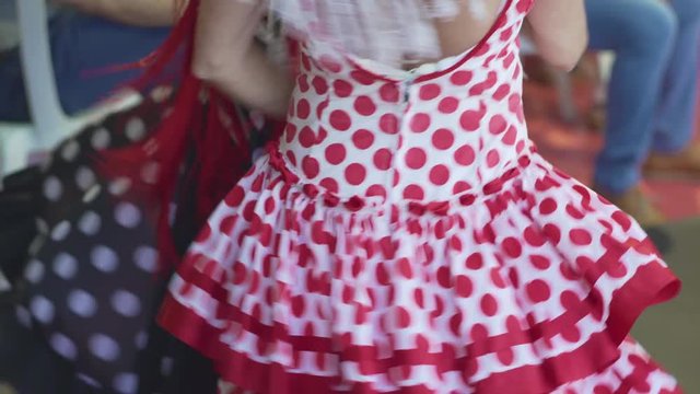 Spain - Flamenco. Women in traditional dresses dancing flamenko.
