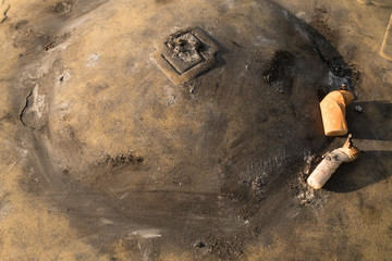 cigarette after smoke in ashtray.