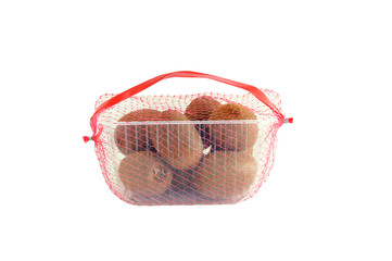 Kiwi in a plastic tray in the grid. Packaging for sale. White isolate