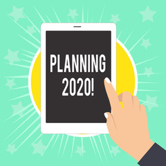 Writing note showing Planning 2020. Business concept for process of making plans for something next year Female Hand with White Polished Nails Pointing Finger Tablet Screen Off