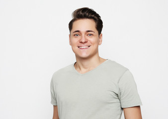 portrait of a young man surprised face expression over white background