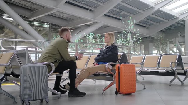 Man befriend a woman in airport.