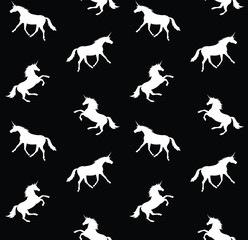 Vector seamless pattern of white unicorn silhouette and heart isolated on black background