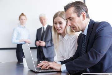 Office workers and laptop