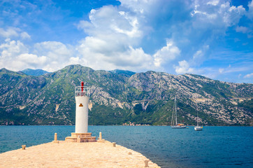 Fototapeta na wymiar Beautiful mediterranean landscape. Our Lady of the Rock Island near town Perast, Kotor bay, Montenegro.