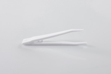 white plastic tweezer. tools used for medical and beauty.