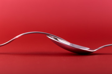 Fork and spoon in red concept