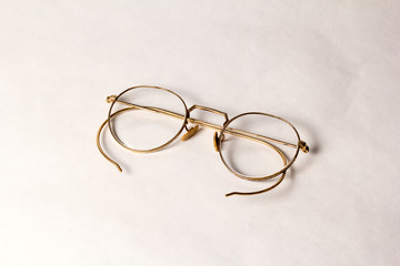 A pair of Antique Eyeglasses on a white background.