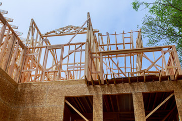 Fototapeta na wymiar House timber frame for a progressing house a new development timber