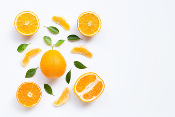 High vitamin C. Fresh orange citrus fruit with leaves isolated on white background.