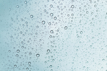 Raindrops on window glasses surface , Natural Pattern of raindrops.