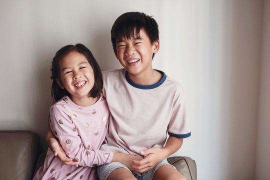 Laughing Asian little brother and sister at home , Happy children portrait