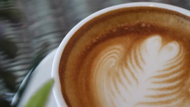 heart latte art of hot coffee drink in cup