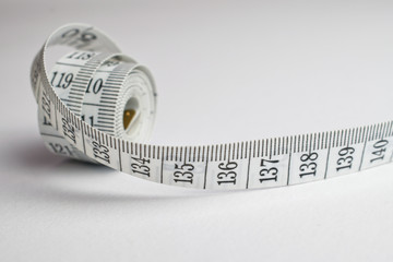 Close up of a rolled tape measure