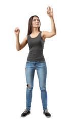 Young woman in gray top and blue jeans standing, one hand in 'pinch' gesture and other raised as if touching invisible glass isolated on white background.