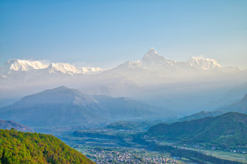 The Annapurna massif and Pokhara city in the morning time at Methlang Hill, Pokhara, Nepal.