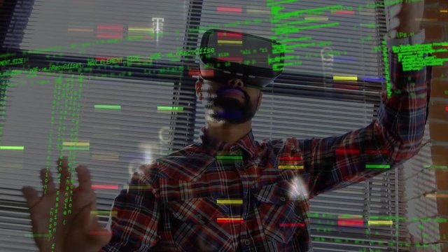 Man wearing virtual goggles and program codes