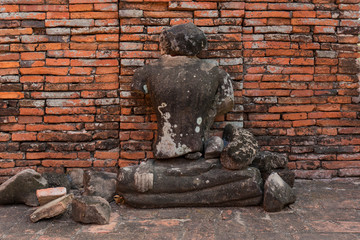 Broken Buddha Ancient temple in Ayutthaya, Thailand. The temple is on the site of the old Royal Palace of ancient capital of Ayutthaya